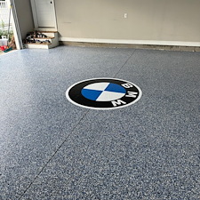 Custom-BMW-logo-flake-epoxy-flooring-project 0