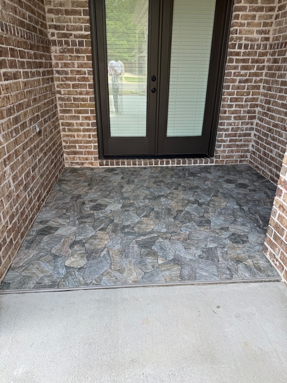 Prestigious dual porch tile installation performed in the Deer Creek subdivision of Montgomery, Alabama